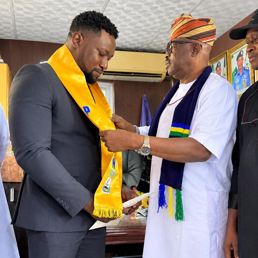 Investiture moment between Mr. Edwin Peprah and Dr. Rufus Ebegba